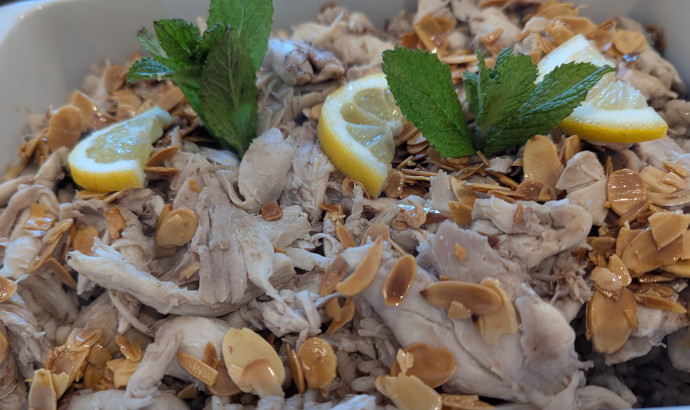 A Lebanese chicken dish with almonds on top